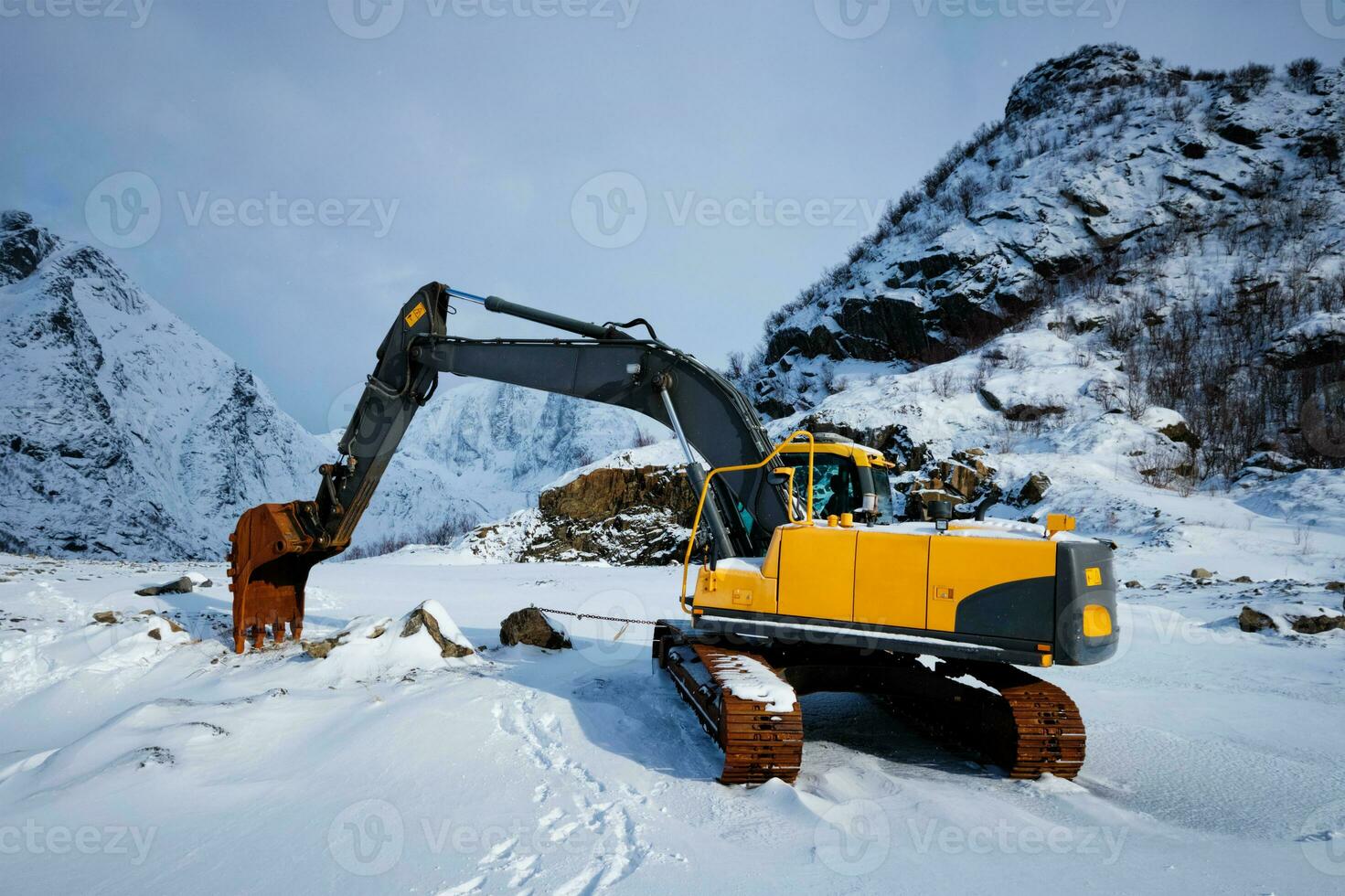 Old excavator in winter photo