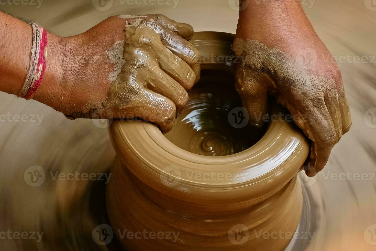 Indian potter hands at work, Shilpagram, Udaipur, Rajasthan, India photo