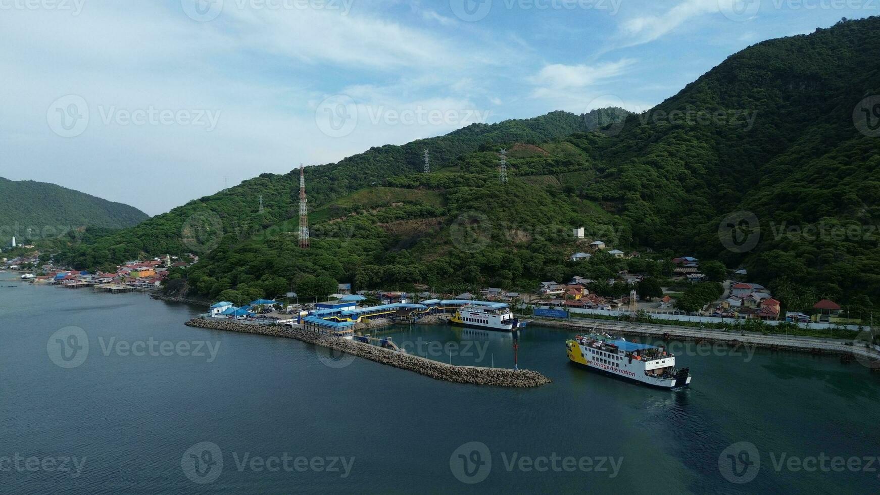 Gorontalo, Indonesia - January 5, 2024 - Aerial View of the Ferry Approaching the Port of Gorontalo, Gorontalo City in the Morning photo