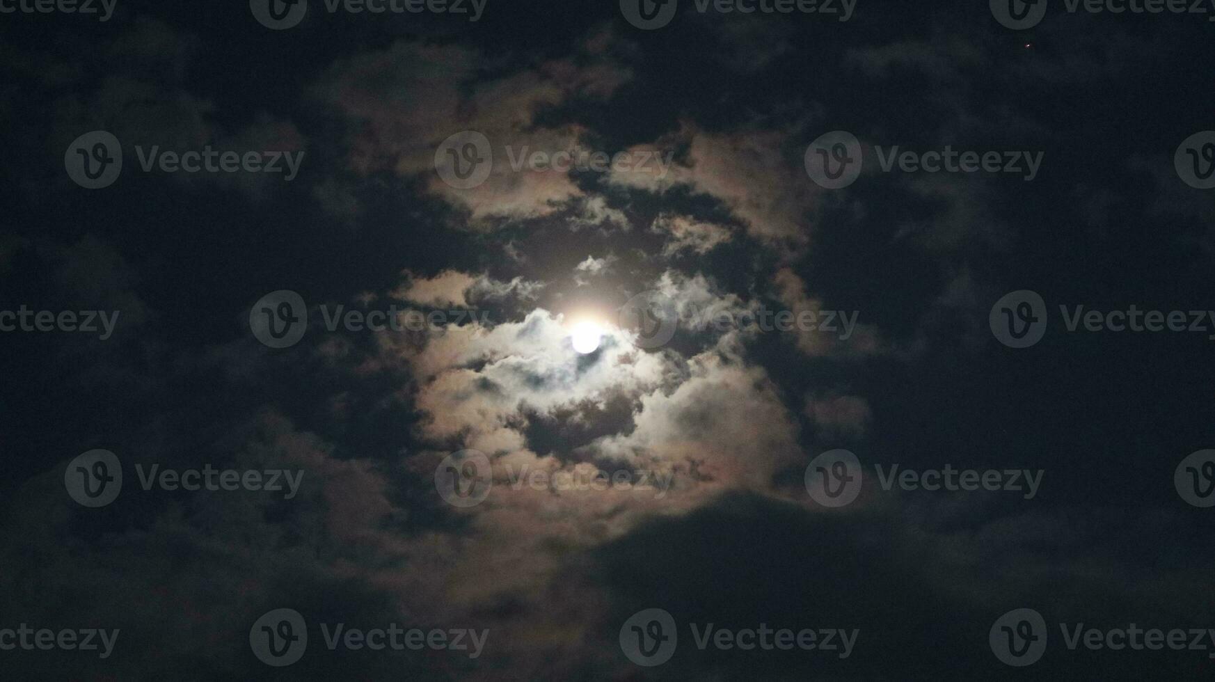 Beautiful magic blue night sky with clouds and full moon photo