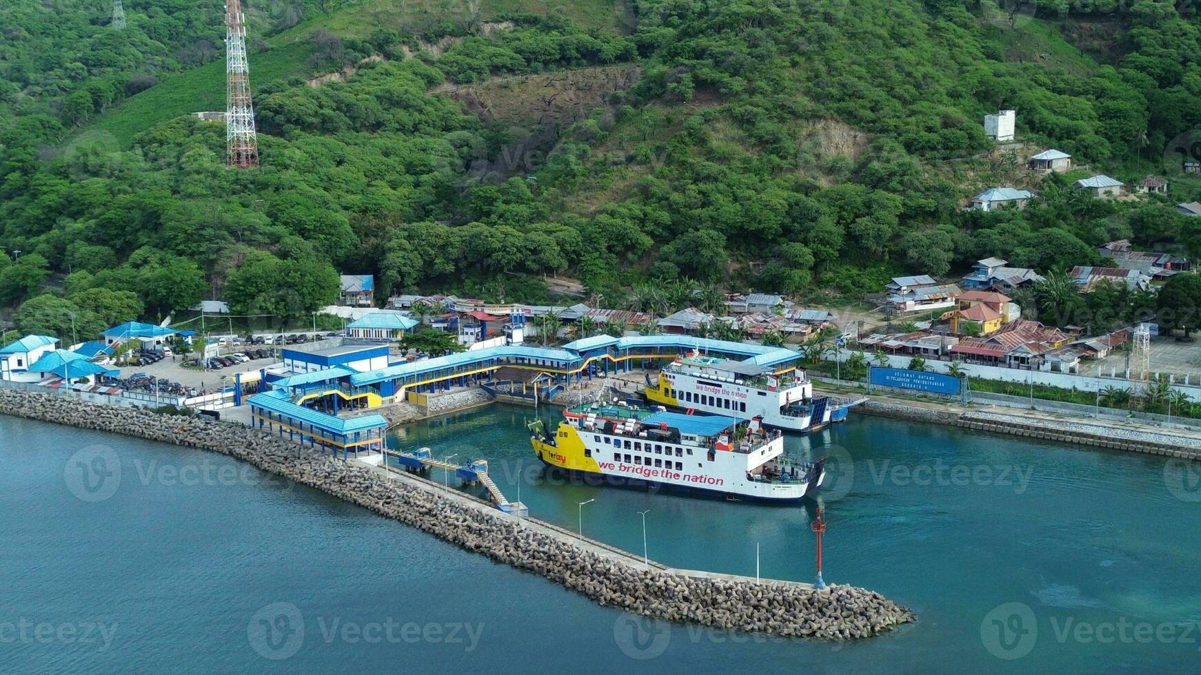 Gorontalo, Indonesia - January 5, 2024 - Aerial View of the Ferry Approaching the Port of Gorontalo, Gorontalo City in the Morning photo