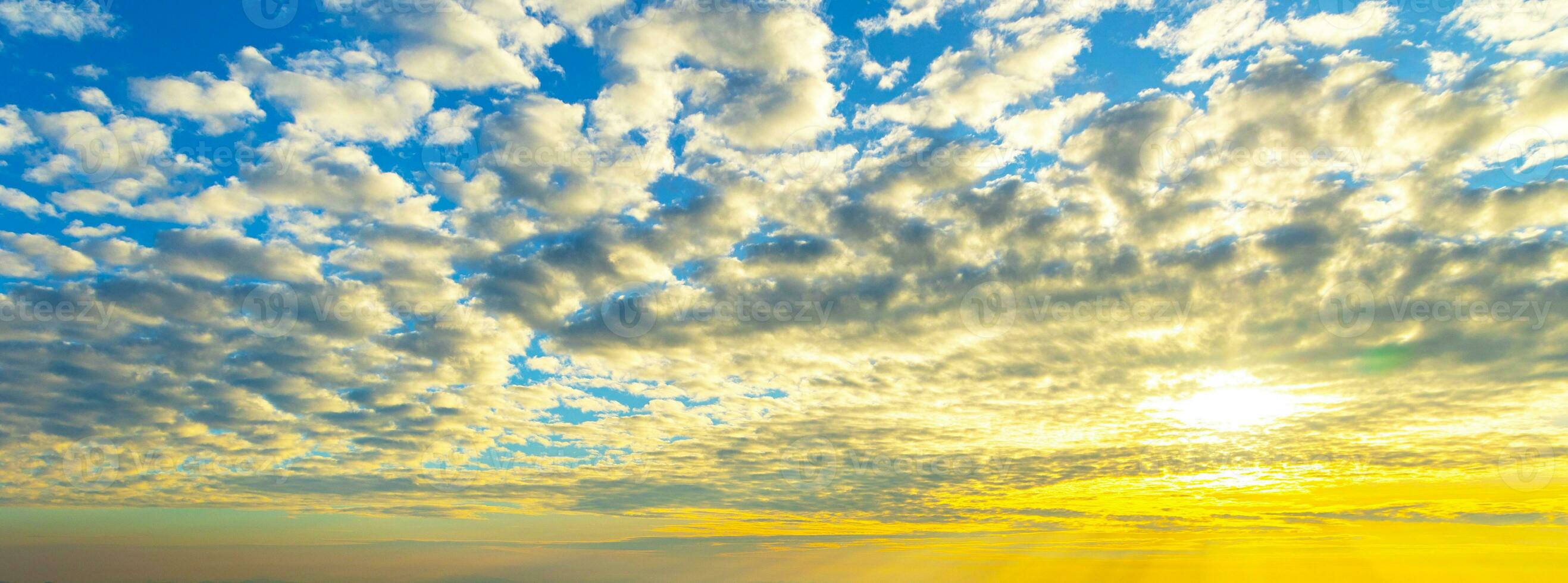 Sunset Sky on Twilight in the winter Evening with Orange Gold Sunset Cloud Nature Colorful Sky Backgrounds, Horizon Golden Sky, Gorgeous. photo