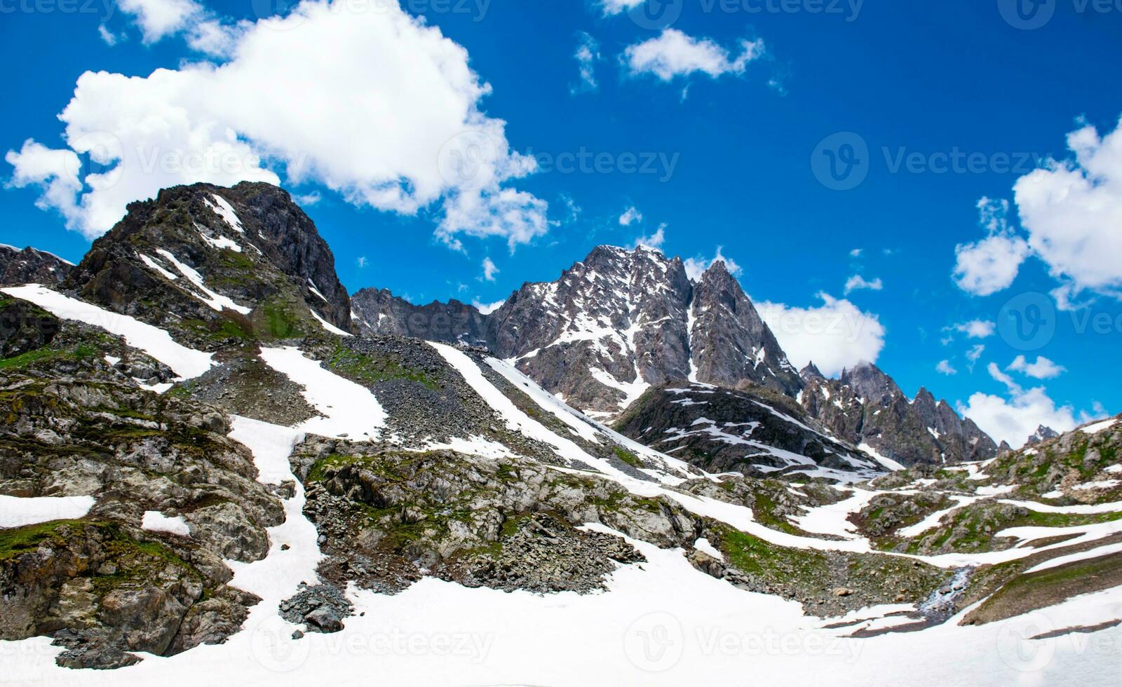 Landscape in the mountains. Panoramic view from the top of Sonmarg, Kashmir valley in the Himalayan region. meadows, alpine trees, wildflowers and snow on mountain in india. Concept travel nature. photo