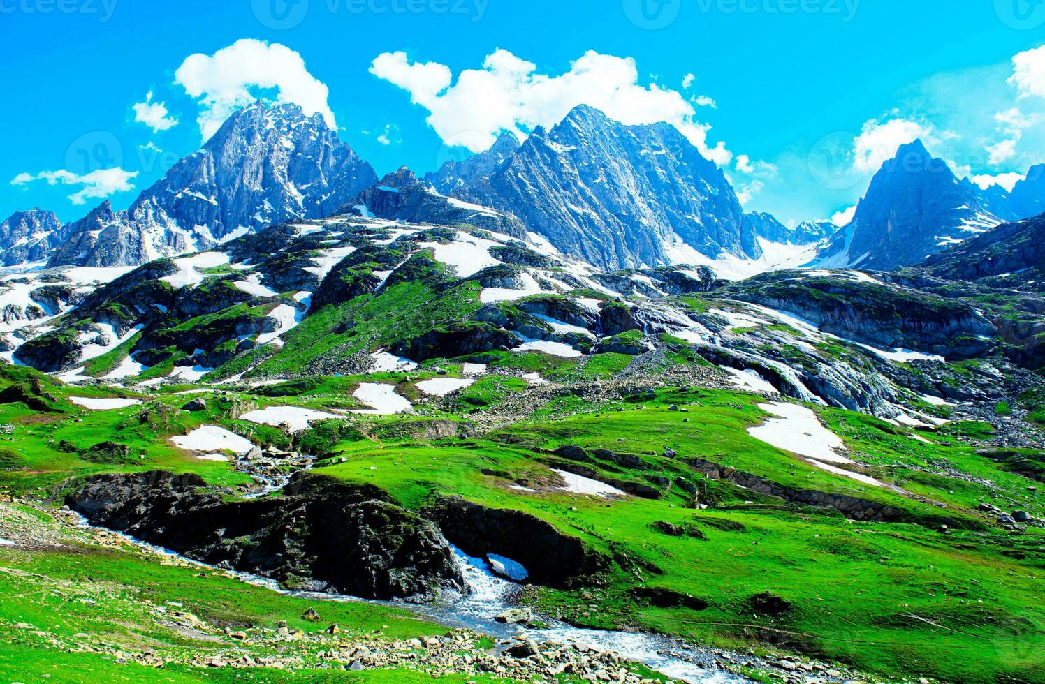 Landscape in the mountains. Panoramic view from the top of Sonmarg, Kashmir valley in the Himalayan region. meadows, alpine trees, wildflowers and snow on mountain in india. Concept travel nature. photo