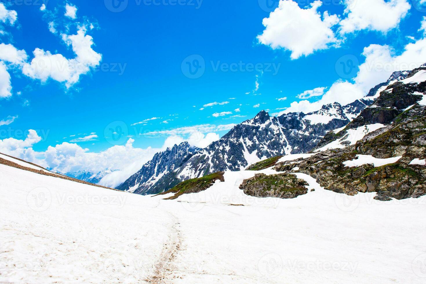 Landscape in the mountains. Panoramic view from the top of Sonmarg, Kashmir valley in the Himalayan region. meadows, alpine trees, wildflowers and snow on mountain in india. Concept travel nature. photo