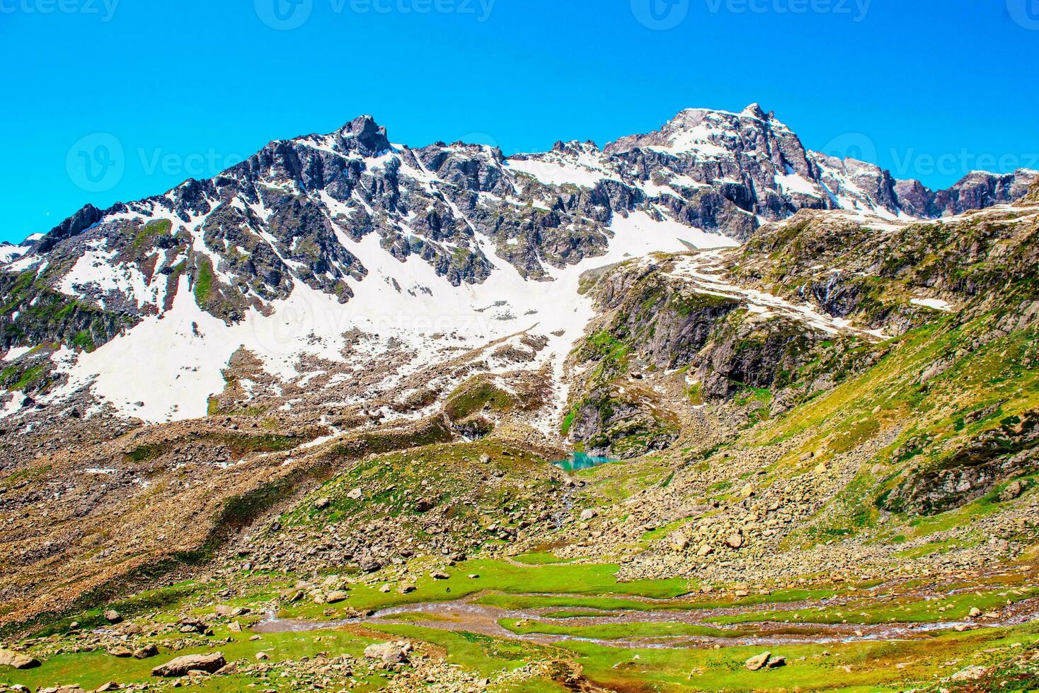 Landscape in the mountains. Panoramic view from the top of Sonmarg, Kashmir valley in the Himalayan region. meadows, alpine trees, wildflowers and snow on mountain in india. Concept travel nature. photo