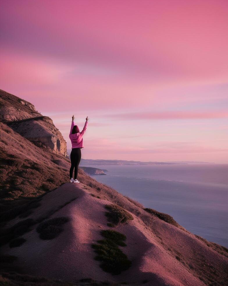 AI generated young woman hiker open arms on top of a mountain at sunrise. ai generative photo