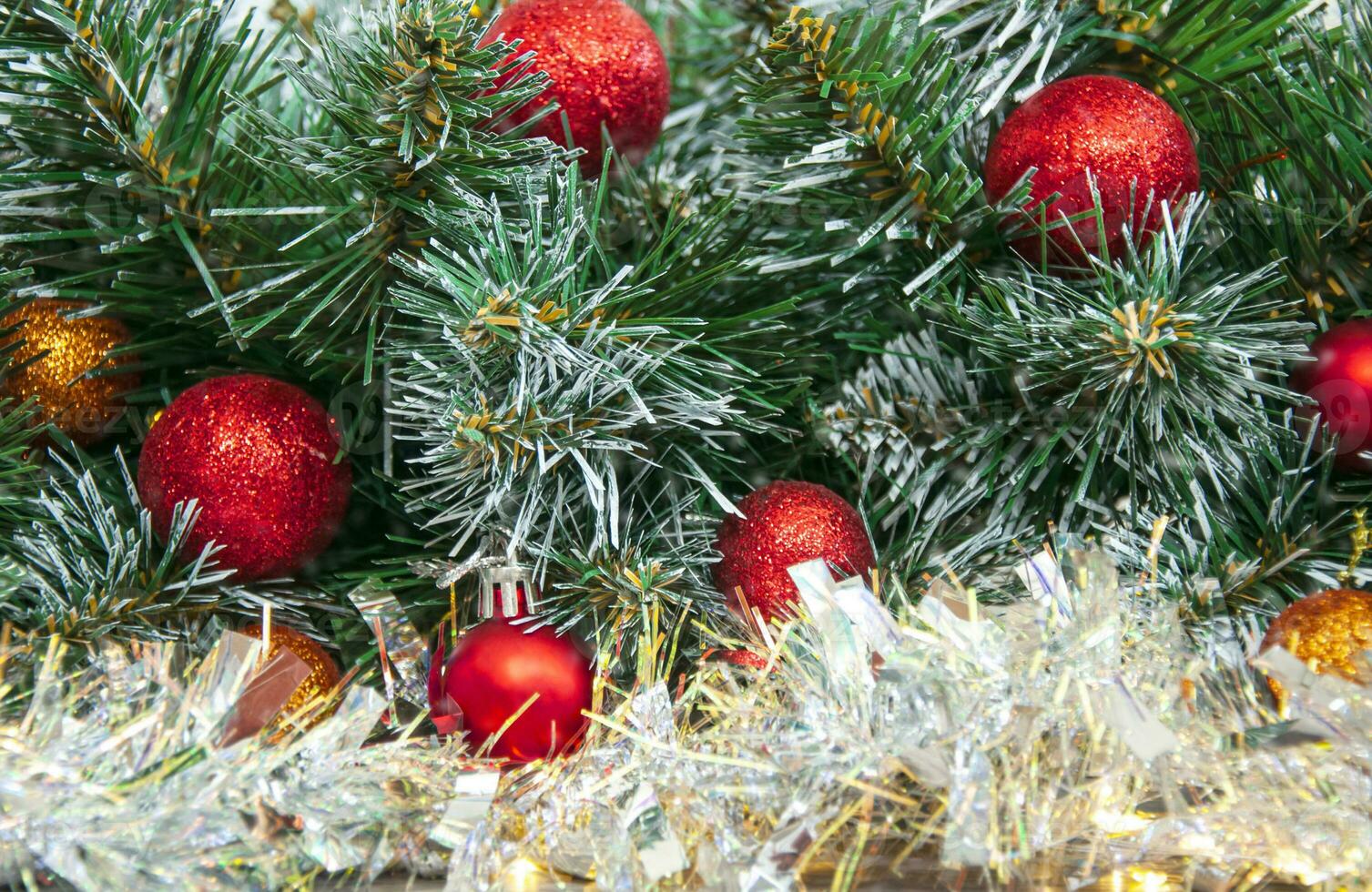 Christmas red decoration close-up on spruce branches. Christmas and New Year holidays background. photo