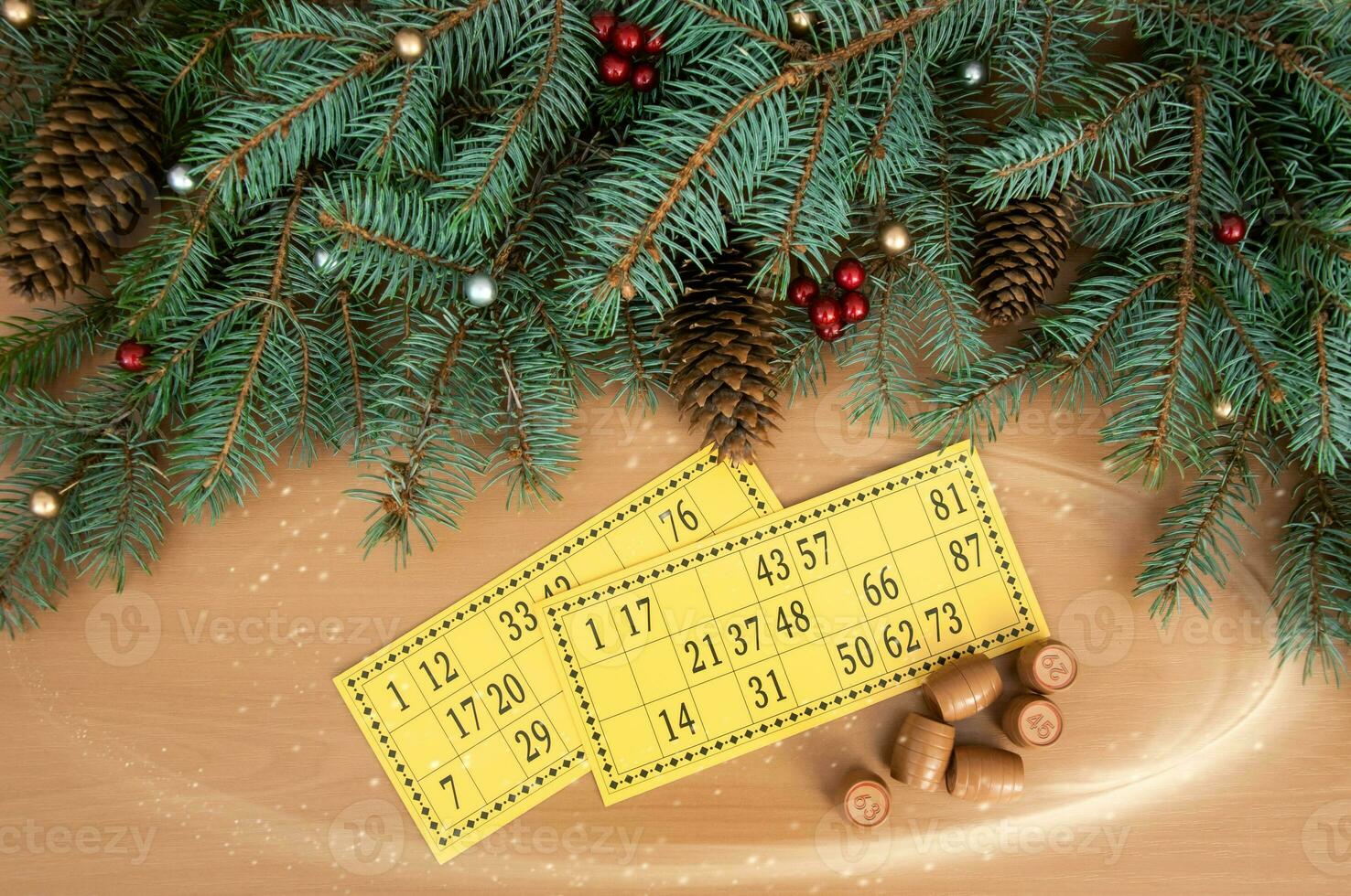 Christmas background. Christmas tree branches, cones of a lotto card with numbers and barrels. Success and good luck. photo
