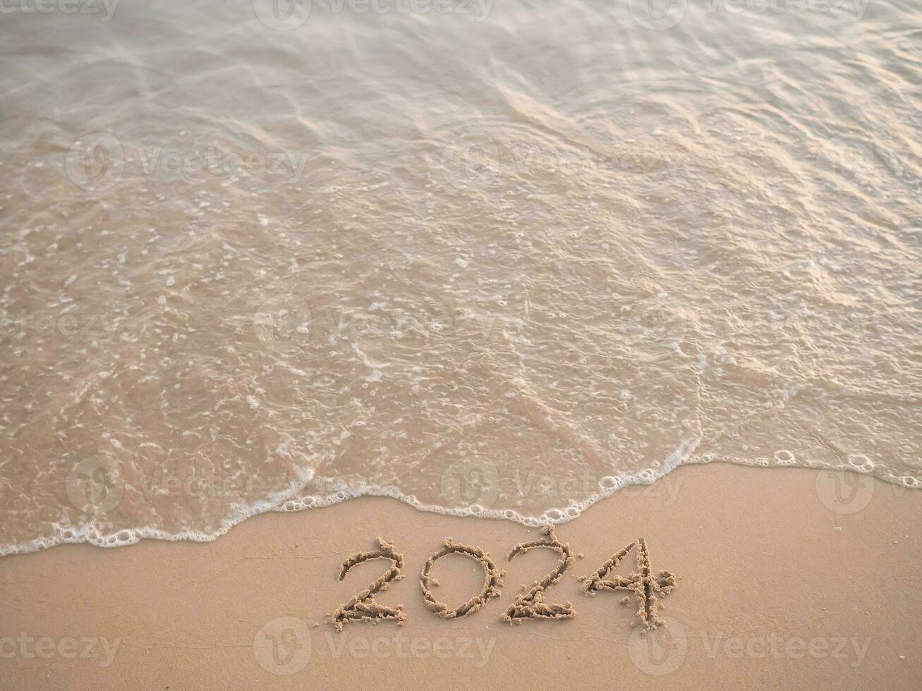 2024 year written on the beach in the sunset time. New Year 2024 concept photo
