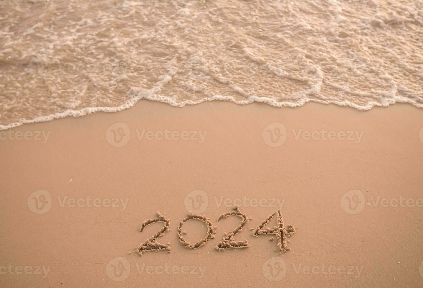 2024 year written on the beach in the sunset time. New Year 2024 concept photo