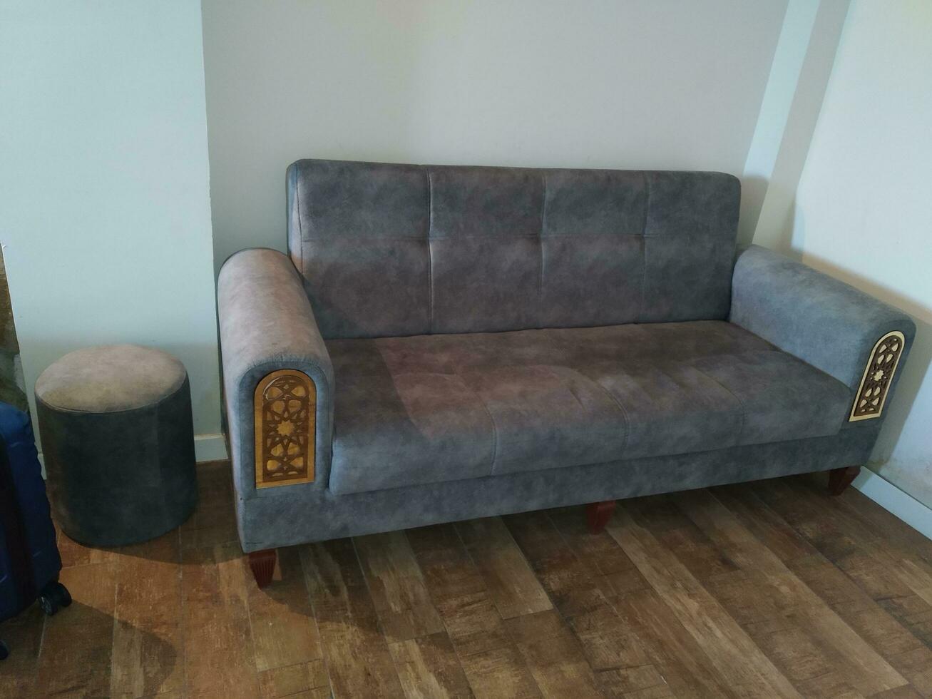 Sofa in the living room of a modern house, closeup of photo