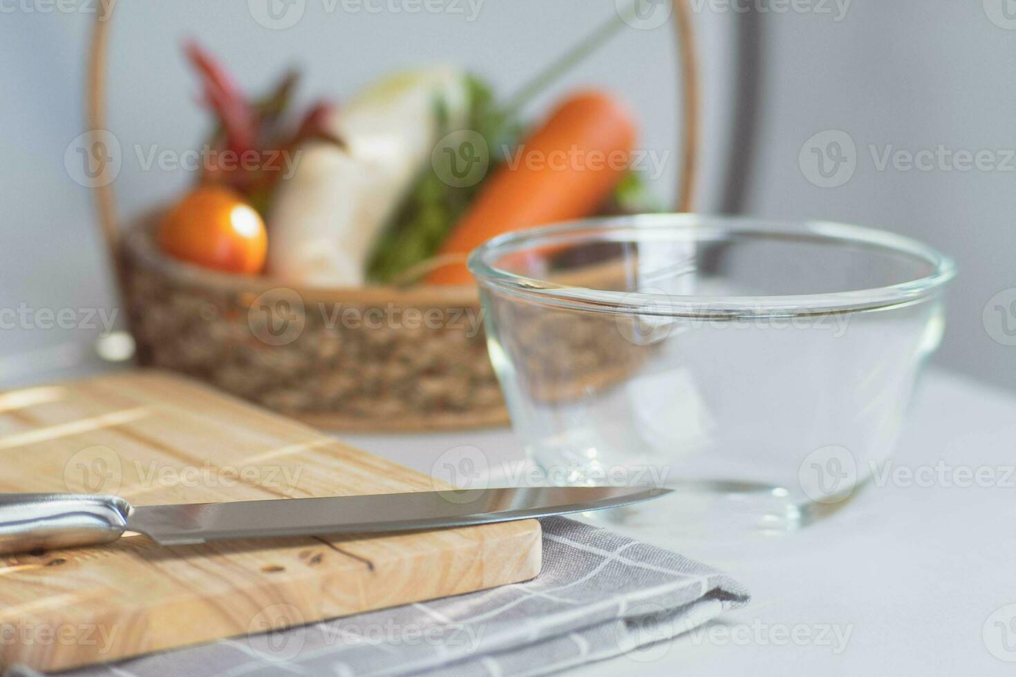 Organic vegetables and kitchen utensils prepared for cooking in the kitchen. Healthy homemade food photo