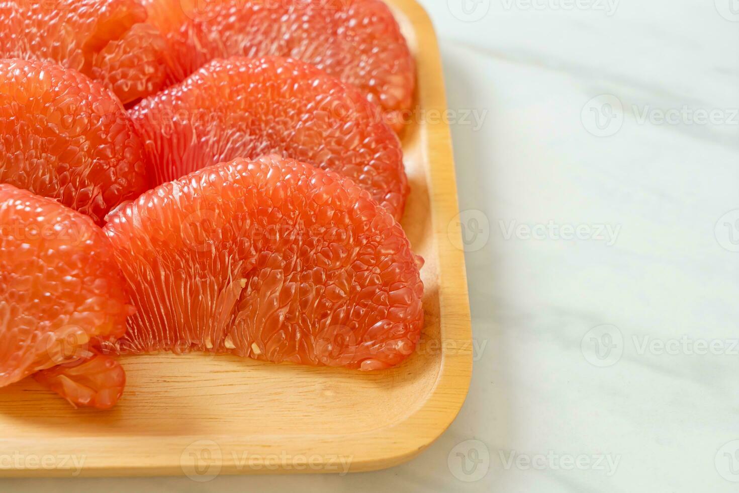 fresh red pomelo fruit or grapefruit photo