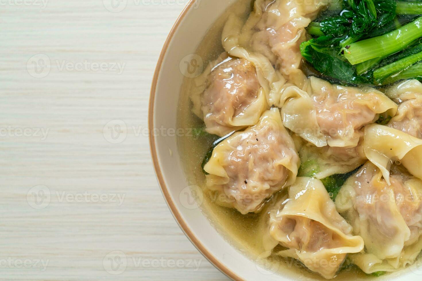 pork wonton soup or pork dumplings soup with vegetable photo