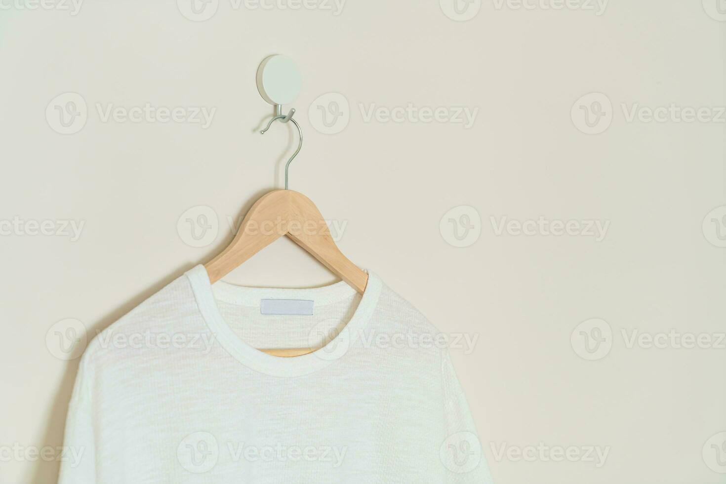 t-shirt hanging with wood hanger photo