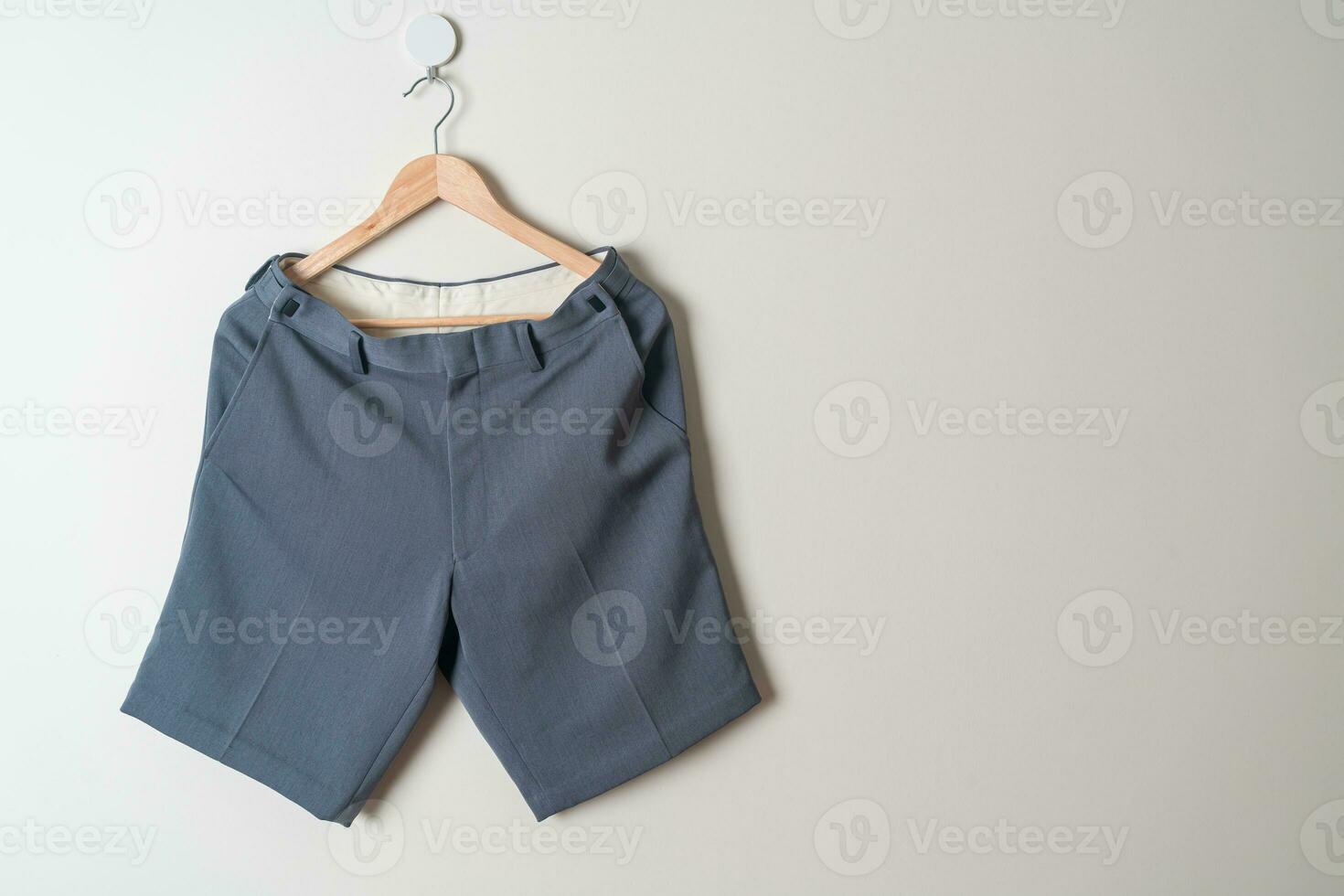 short pants hanging on wall photo