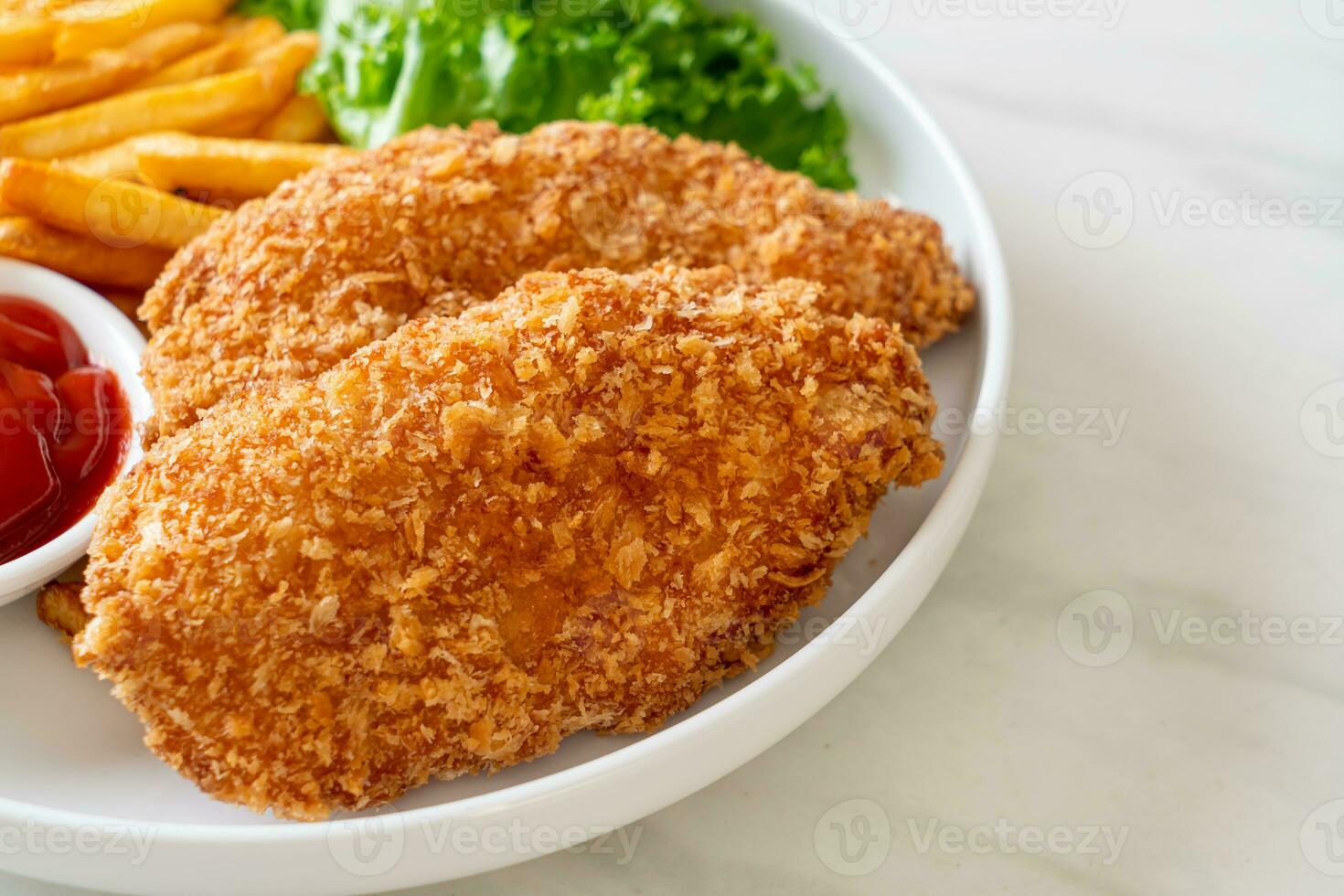 fried chicken breast fillet steak with french fries photo