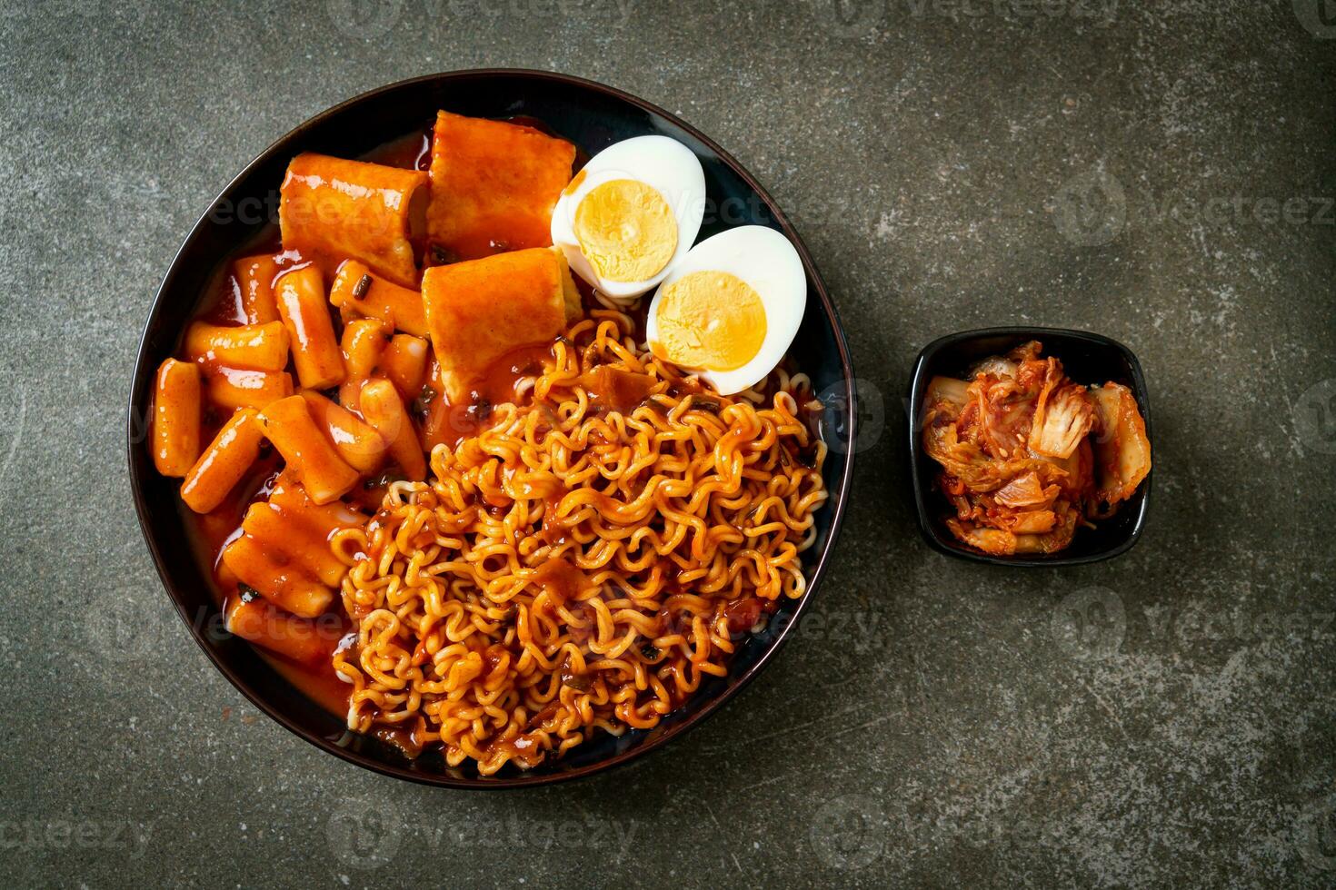 Korean instant noodles with Korean rice cake and fish cake and boiled egg photo