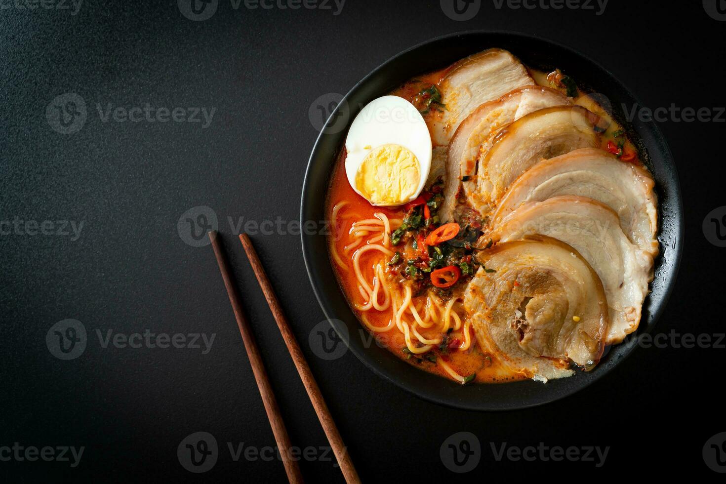 Ramen Noodles Spicy Tomyum Soup with Roast Pork photo