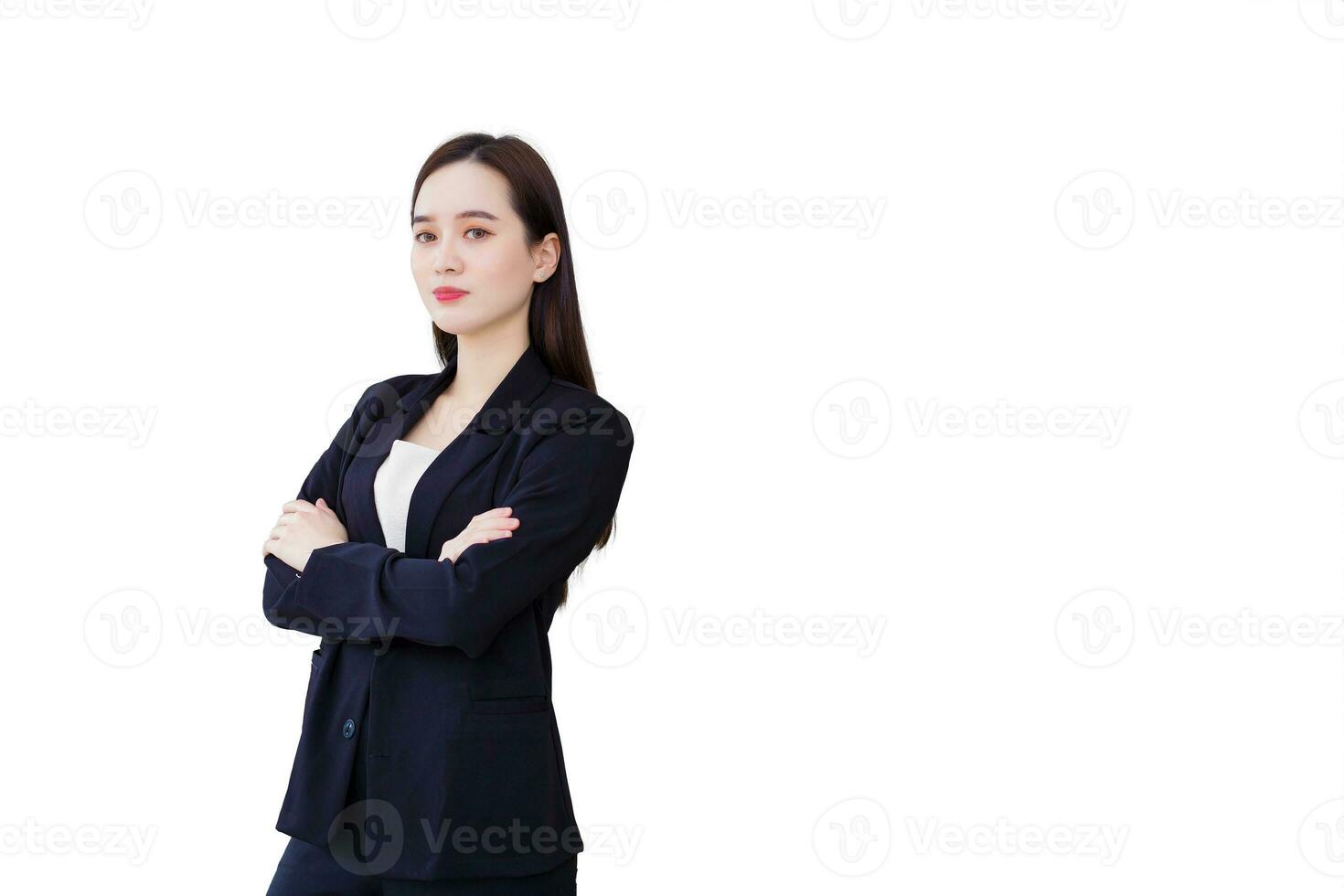 Young beautiful asian professional businesswoman successful with crossed arms in office workspace while looking at camera while isolated on white background. photo