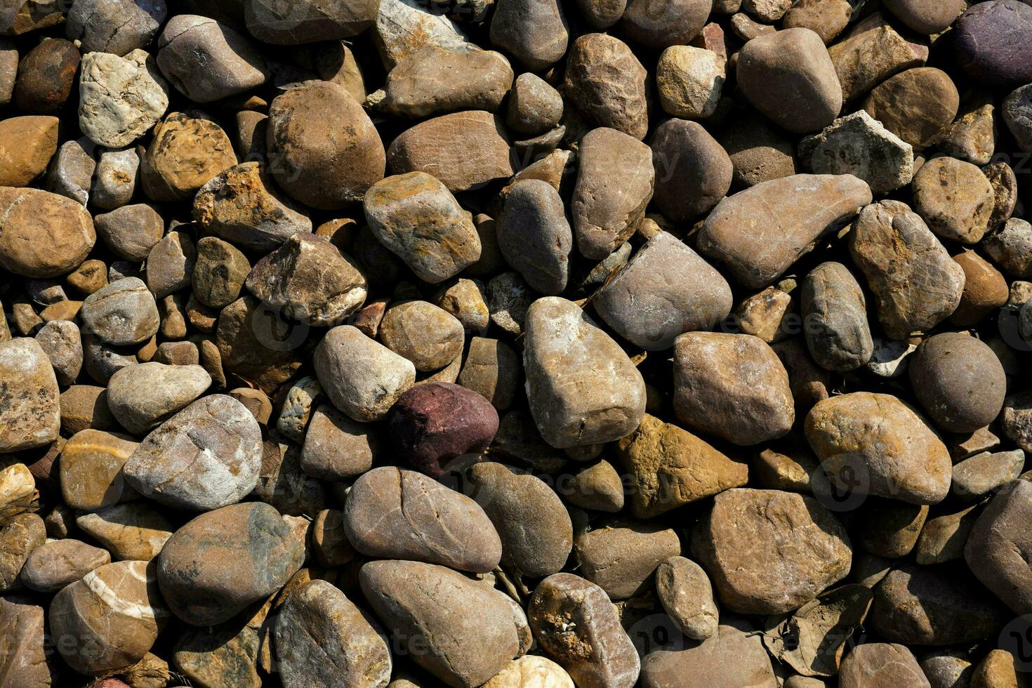 Close-up shot with gravel stones, pebbles as a background. photo