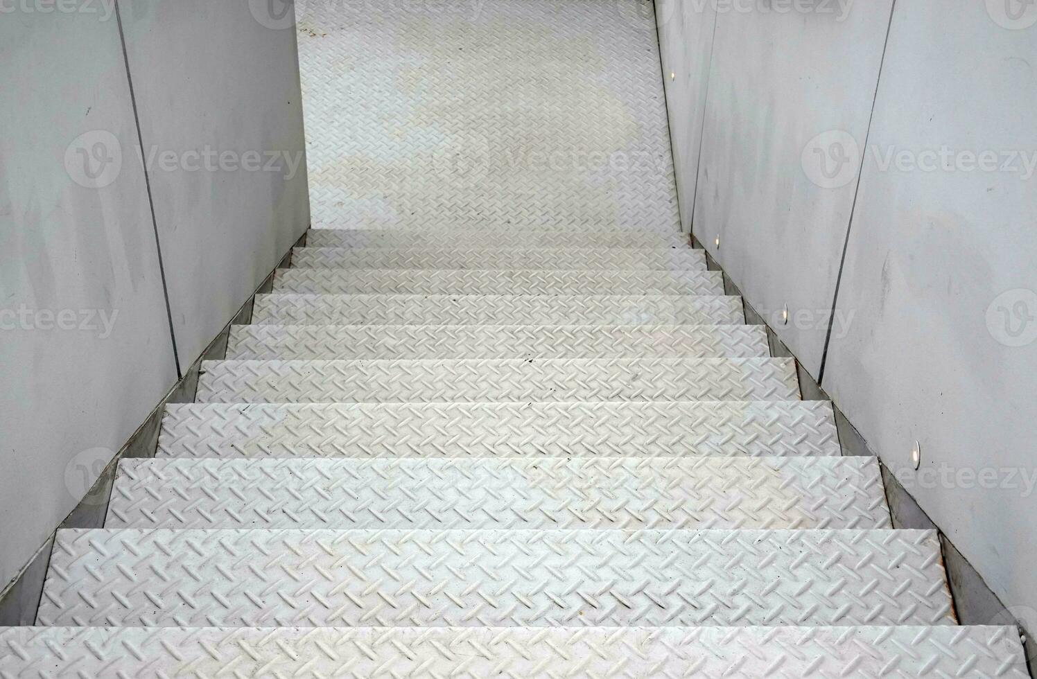 White staircase steel floor plate texture.  Abstract black metal sheet stair photo