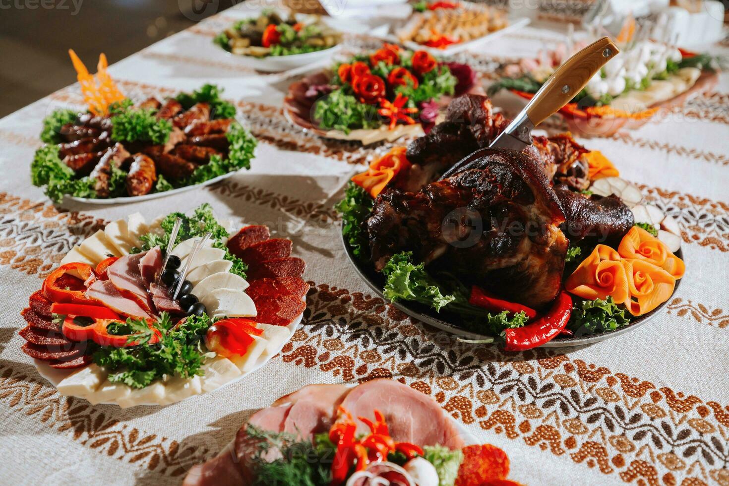 Cossack table in the best restaurants. Festive table at the wedding. National Ukrainian cuisine. Fat, sausages, alcohol. Catering. photo