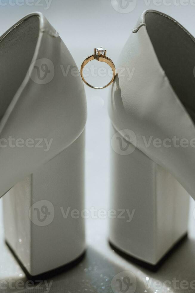 Close up of a gold ring with a diamond. Love, relationship and wedding concept. Soft and selective focus. Free space photo