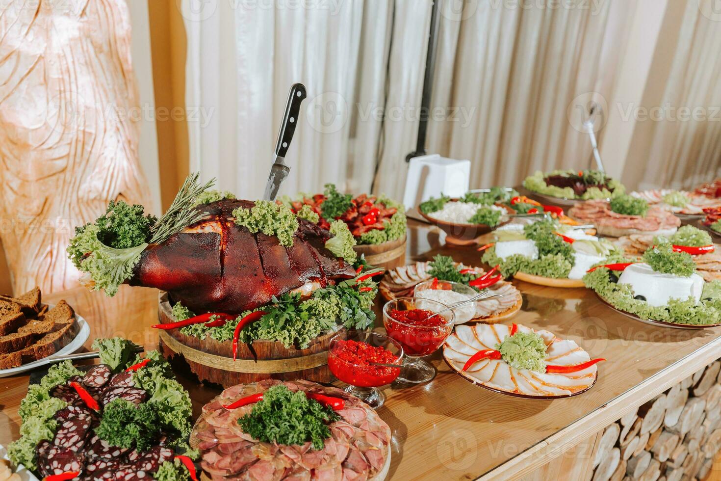 Cossack table in the best restaurants. Festive table at the wedding. National Ukrainian cuisine. Fat, sausages, alcohol. Catering. photo