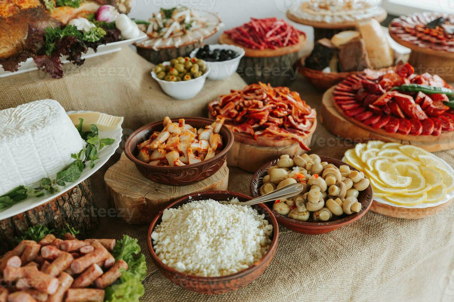 Cossack table in the best restaurants. Festive table at the wedding. National Ukrainian cuisine. Fat, sausages, alcohol. Catering. photo