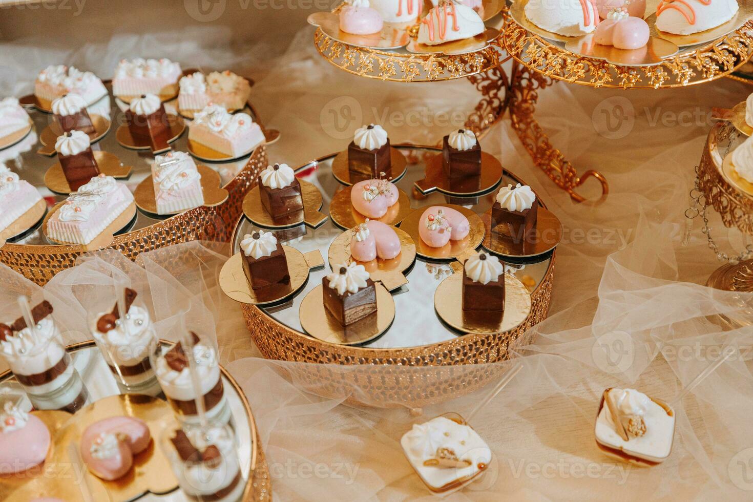 A delicious wedding. Candy bar with various chocolates. Fruit table. Celebration concept. Fashionable desserts. Table with sweets, candies. photo