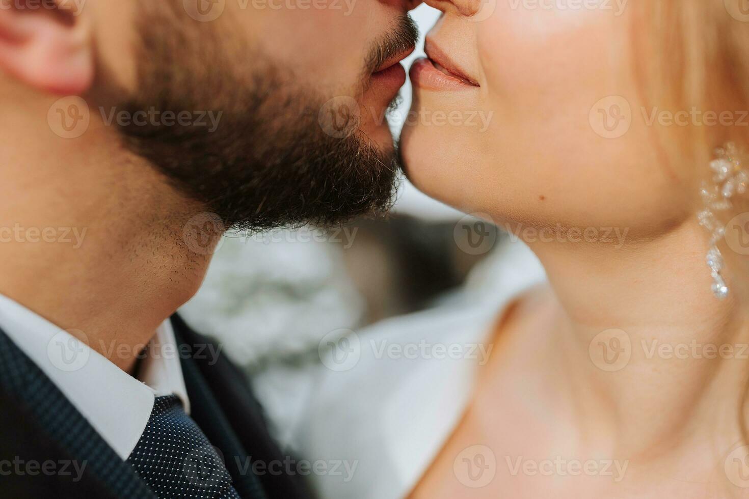 Close-up of the lips of a man and a woman who want to kiss. A stylish man and an elegant girl, a second before a kiss photo