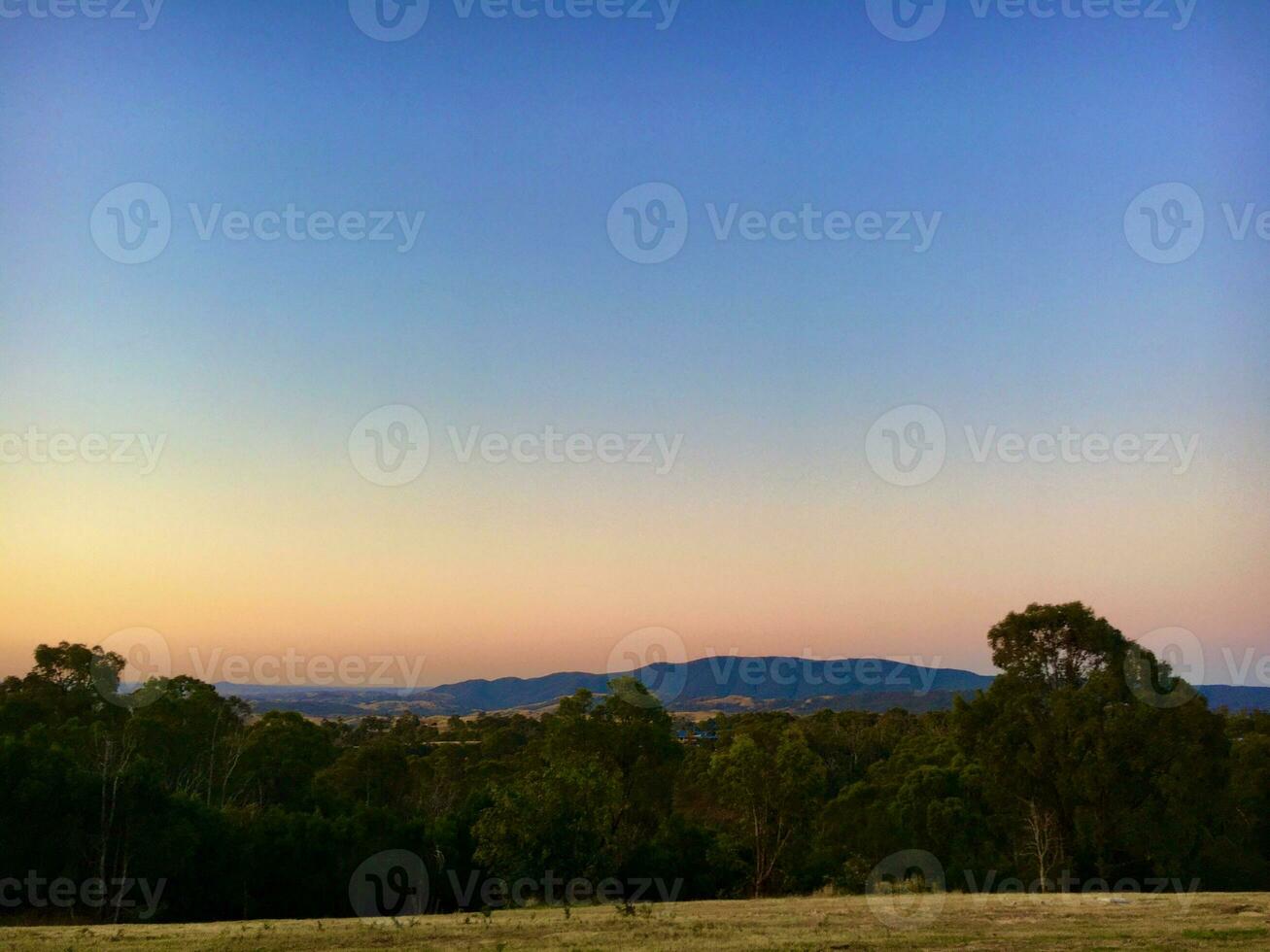 Sunset in the Australian Outback, with the mountains in the background photo