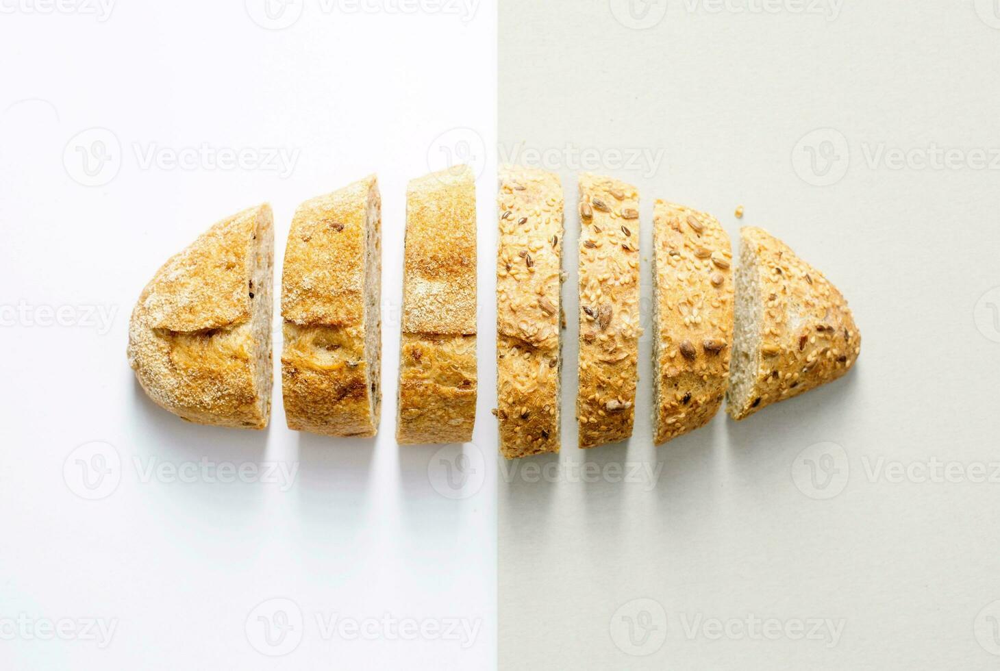 Whole wheat bread on white and grey background. Top view. photo
