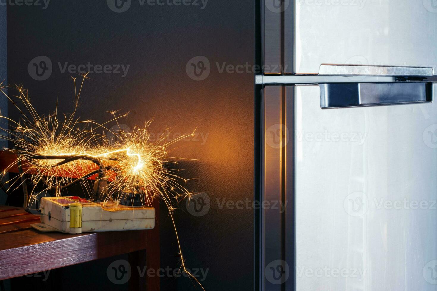 Electric shork, plug, Refrigerator Therefore causing sparks Dangerous concepts from the use of old electrical appliances And without quality Therefore is dangerous to life and property photo