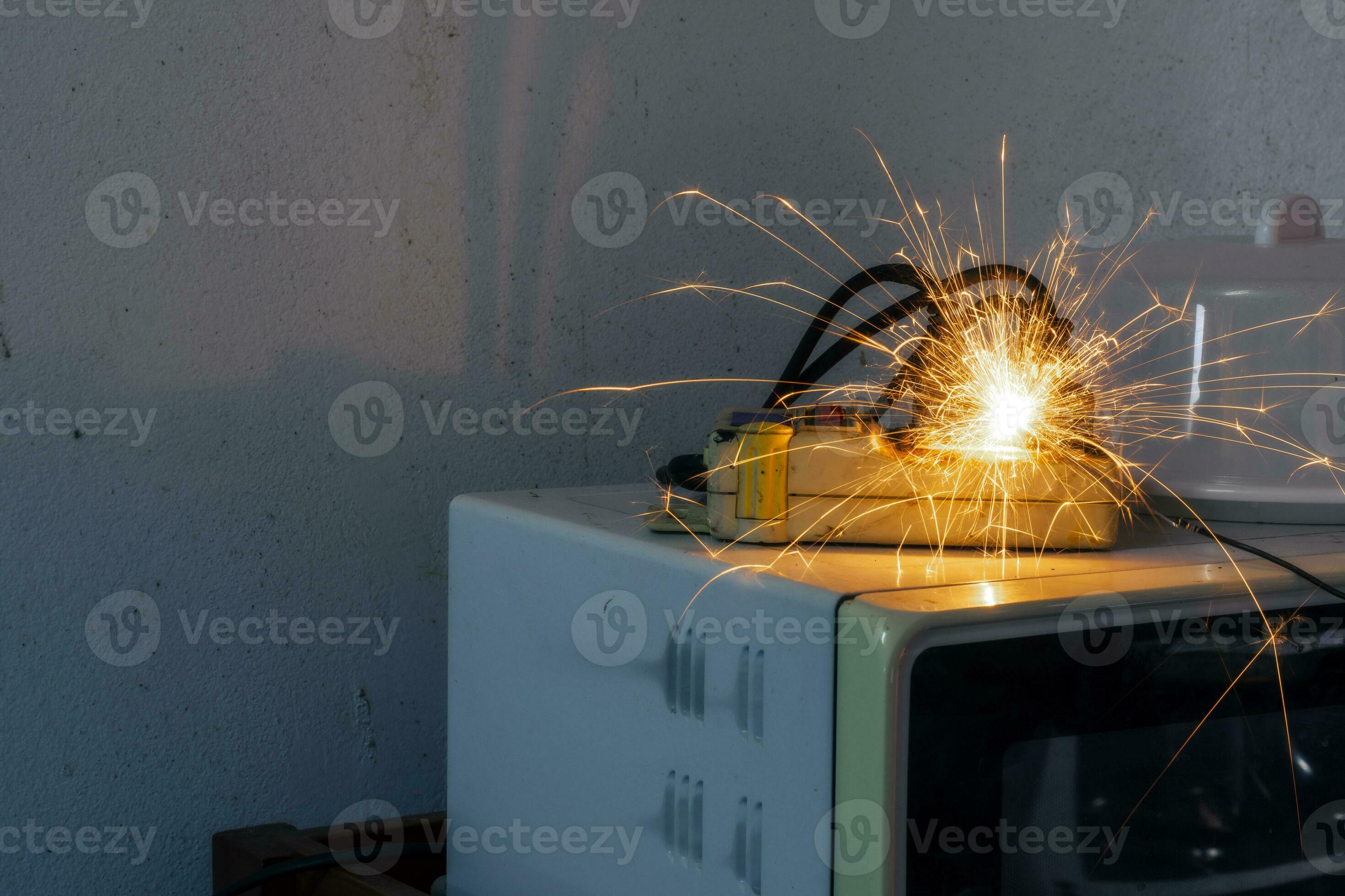 An electric shork from a microwave outlet causes a spark. Dangerous