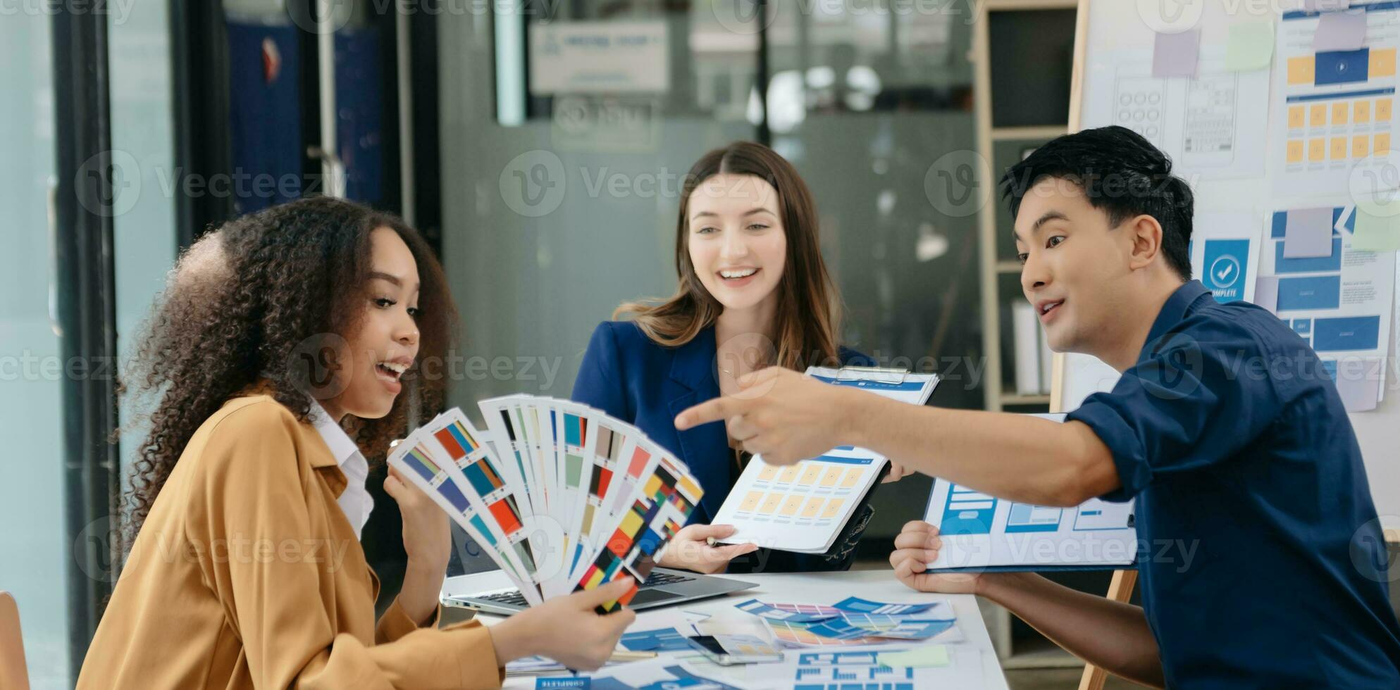 UX developer and ui designer brainstorming about mobile app interface wireframe design with customer breif and color code photo