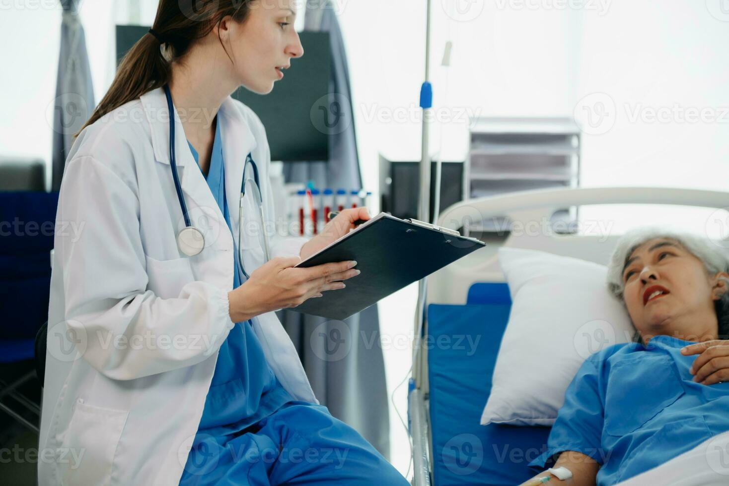 Caucasian doctor smiling take care of a young patient in hospital. Friendly nurse or therapeutic treat client Professional photo