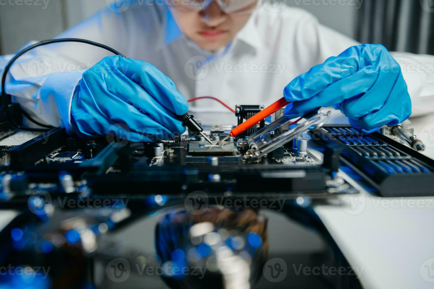 The technician is putting the CPU on the socket of the computer motherboard. electronic engineering electronic repair, electronics photo