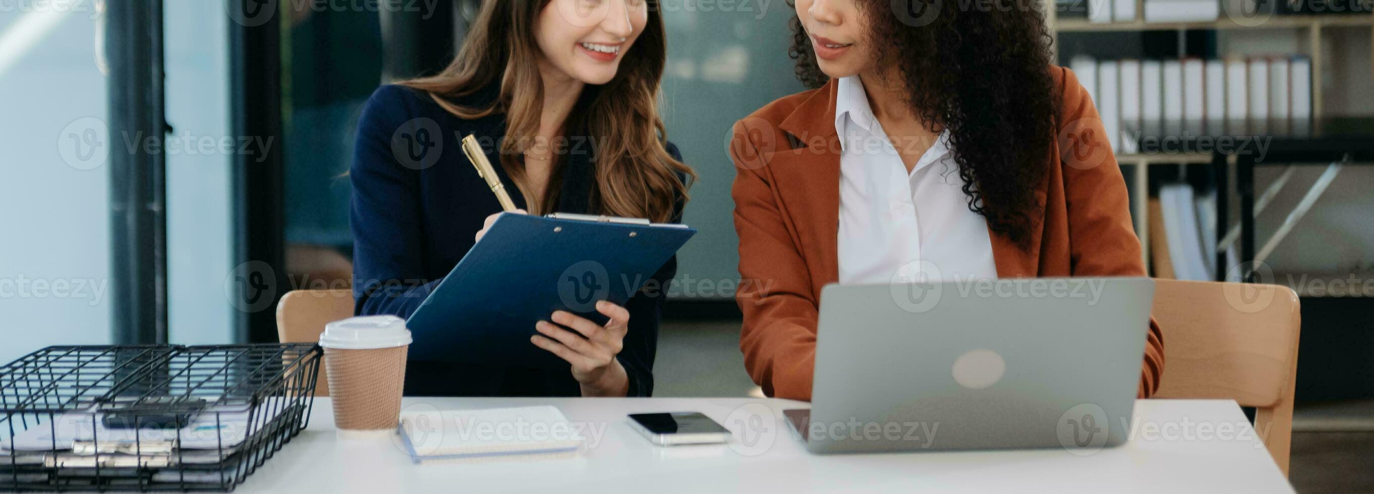 Business colleague business presents and explains and using laptop and tablet. Teamwork, financial marketing team, photo