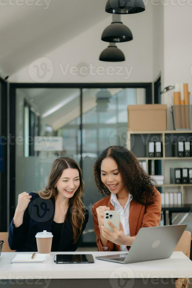 Business colleague business presents and explains and using laptop and tablet. Teamwork, financial marketing team, photo