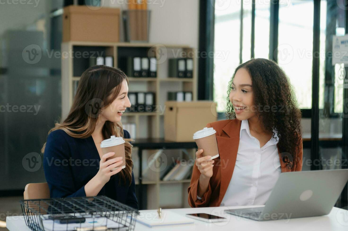 Business colleague business presents and explains and using laptop and tablet. Teamwork, financial marketing team, photo