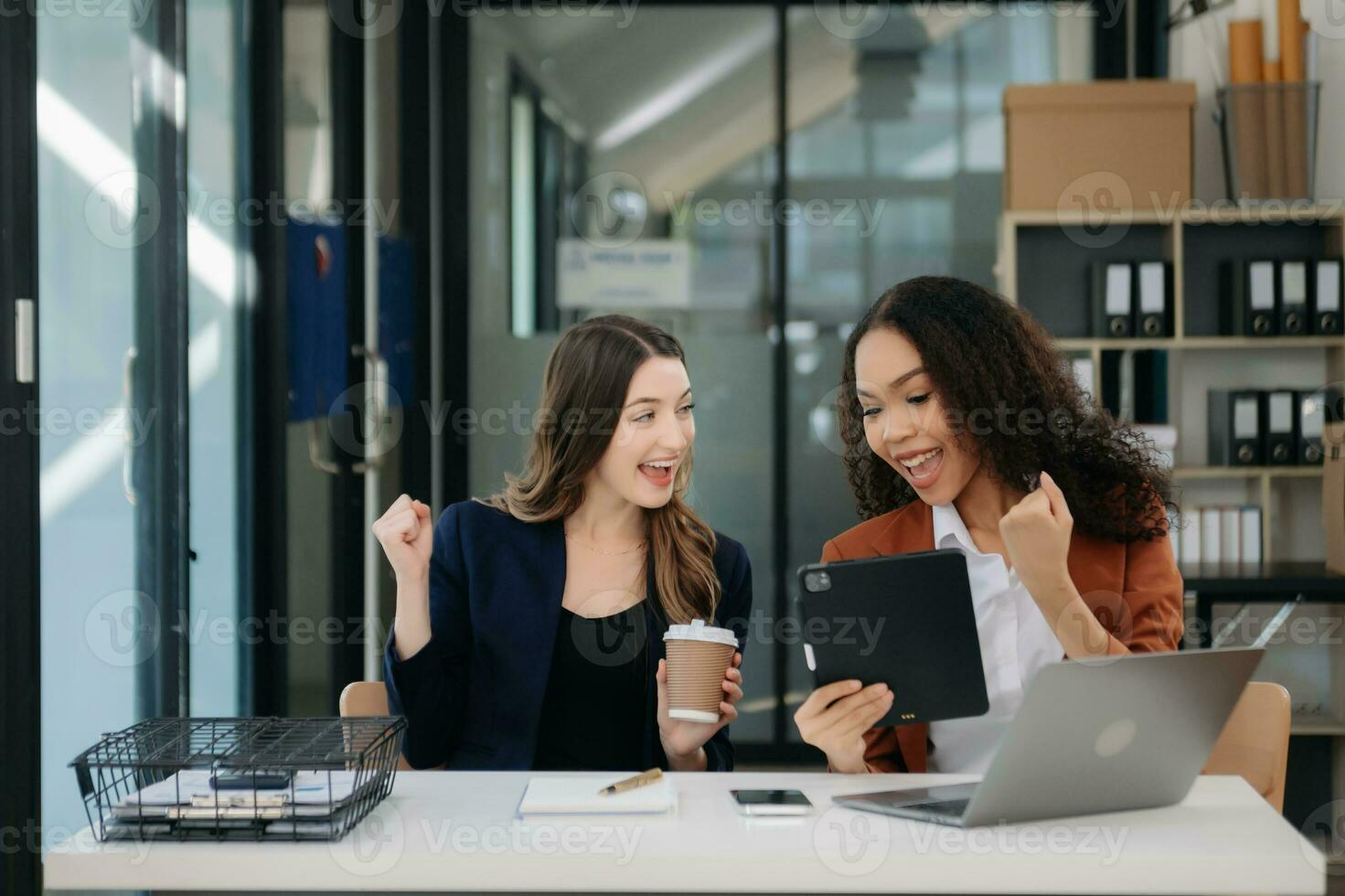 Business colleague business presents and explains and using laptop and tablet. Teamwork, financial marketing team, photo
