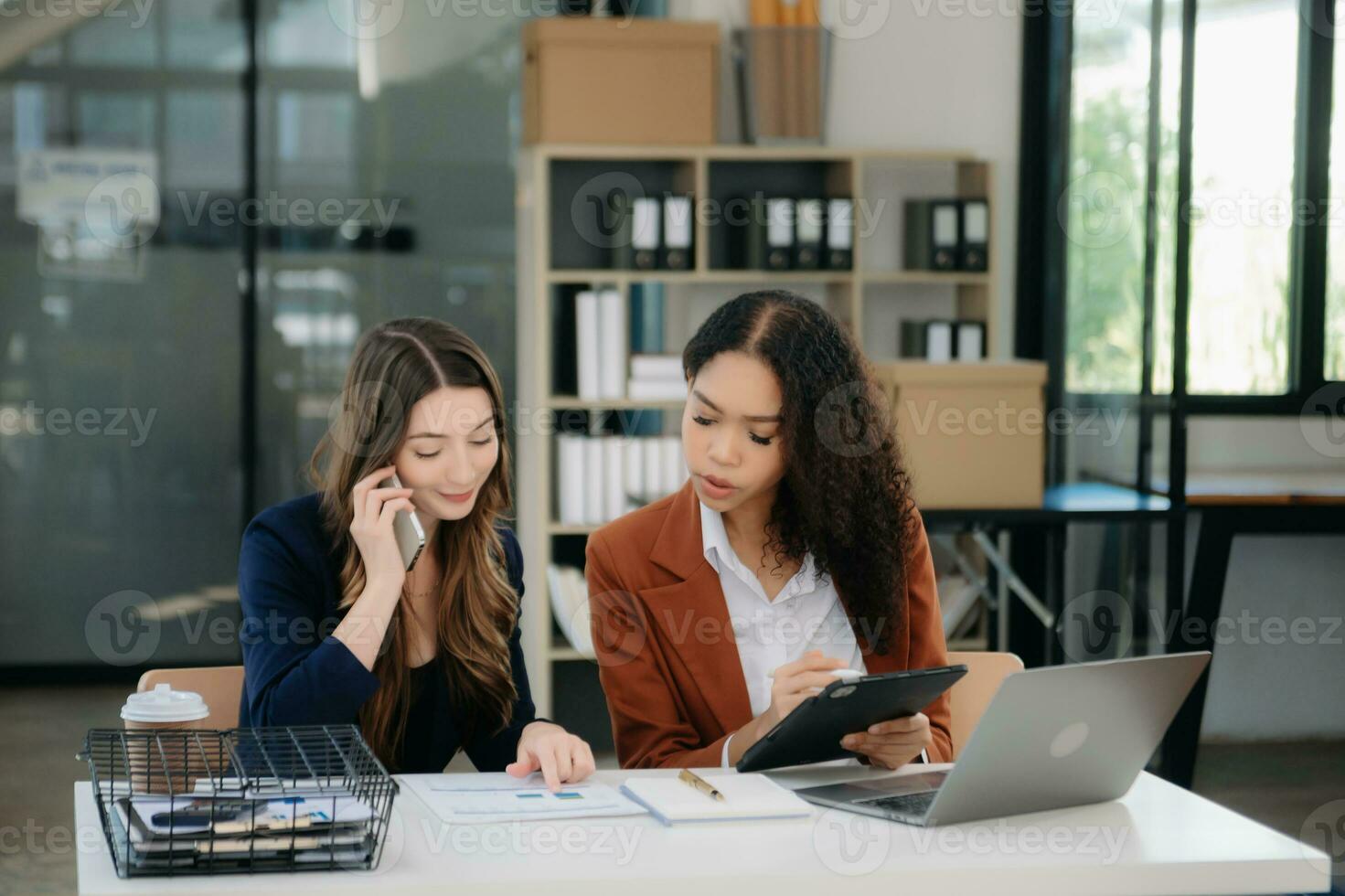 Business colleague business presents and explains and using laptop and tablet. Teamwork, financial marketing team, photo
