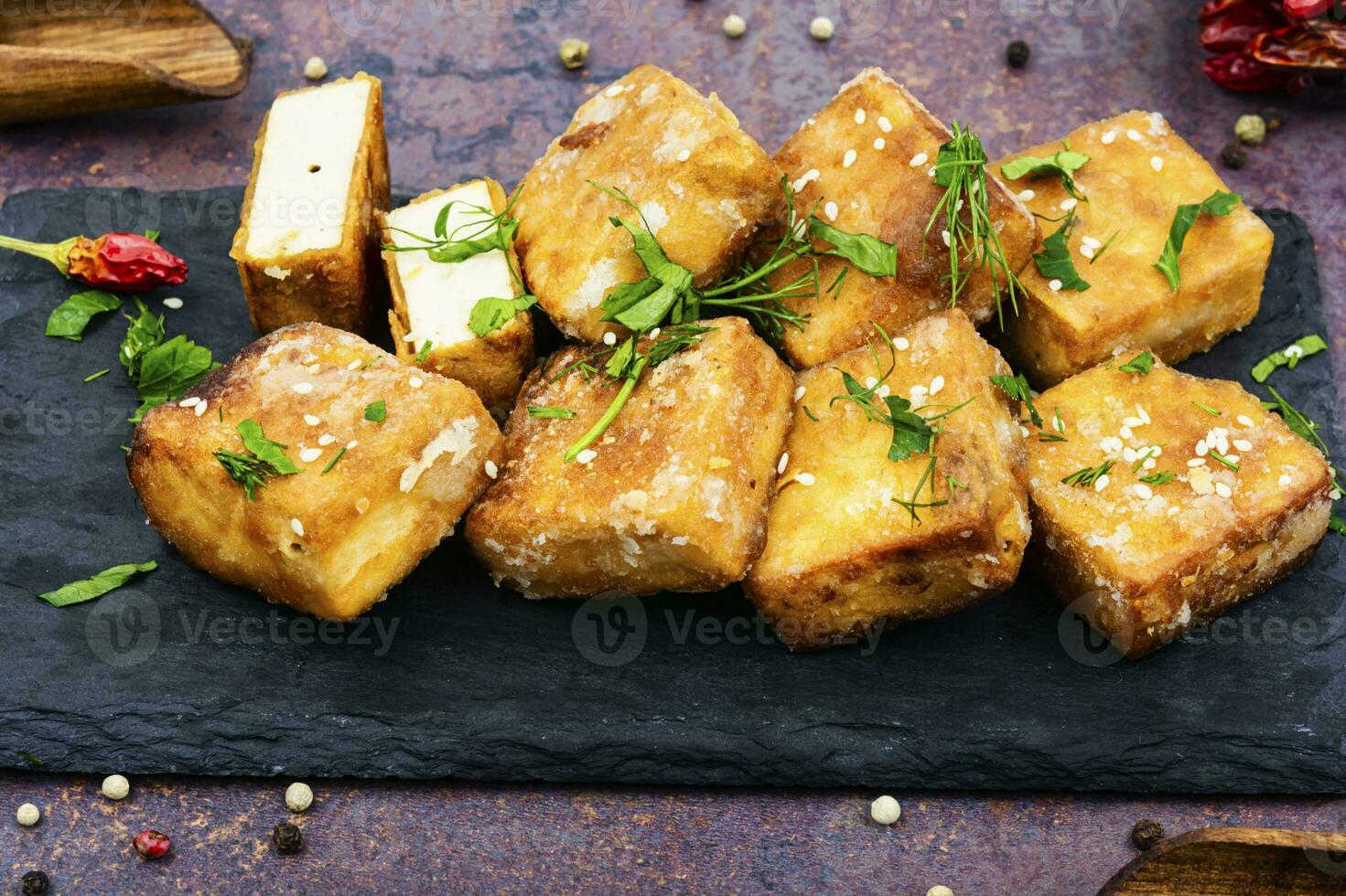 Fried soy cheese tofu, vegan food. photo