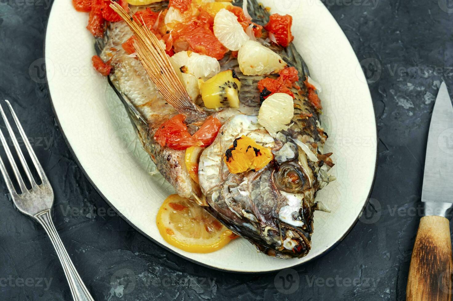 A view of a plate of fried tilapia. photo