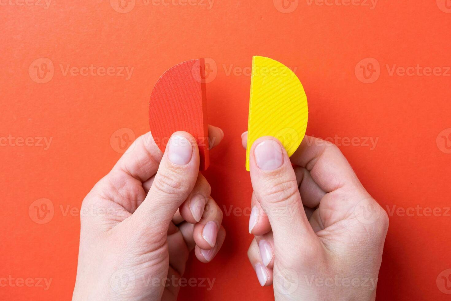 hands working with colorful wooden pie chart pieces photo