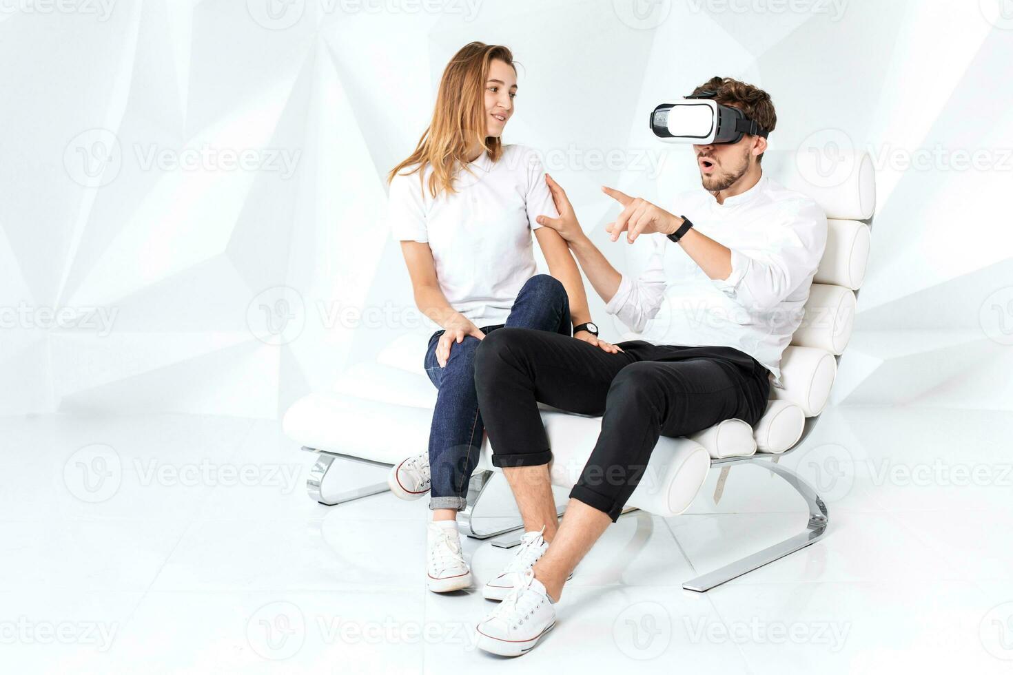 Couple having fun playing with virtual reality photo