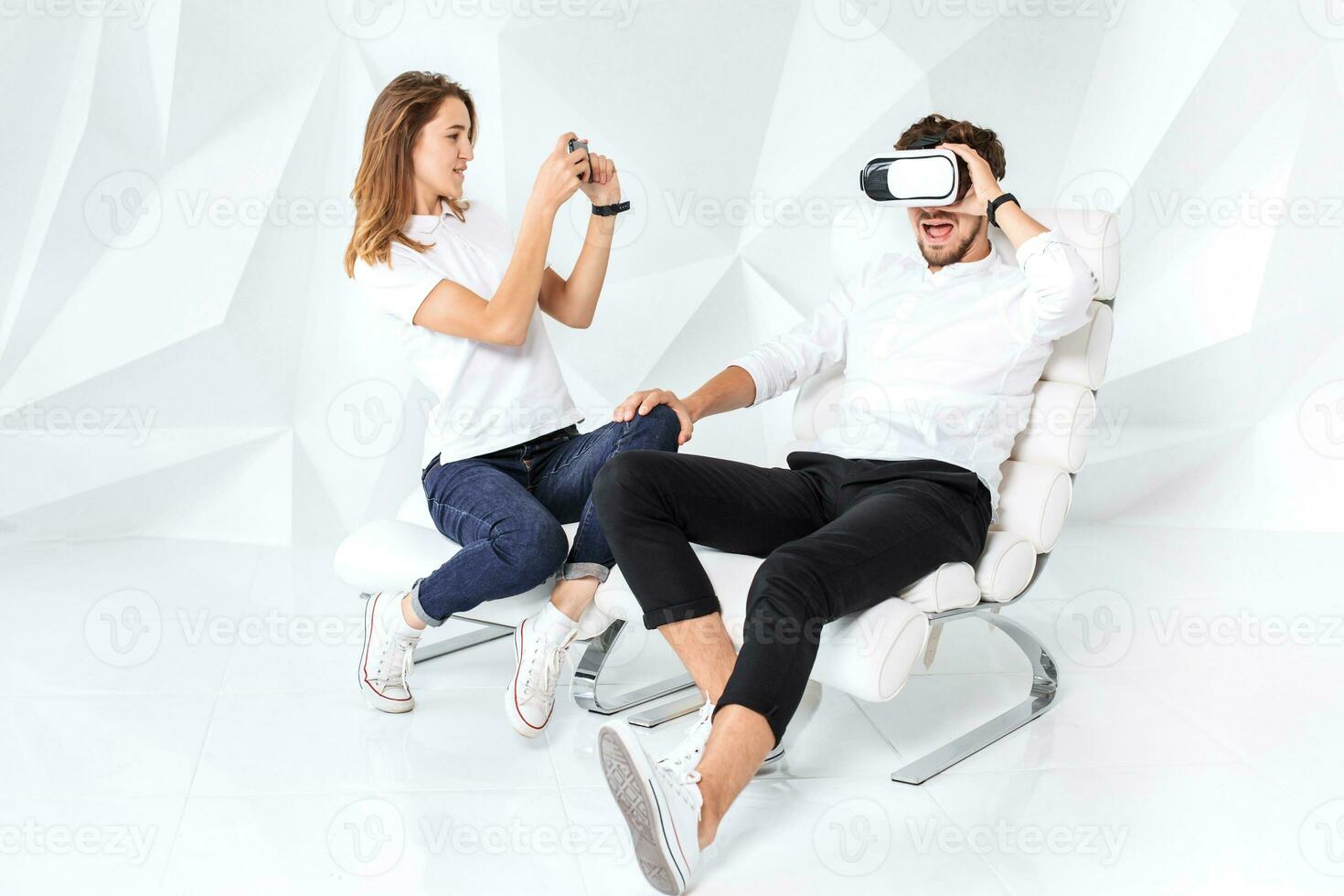 Couple having fun playing with virtual reality photo